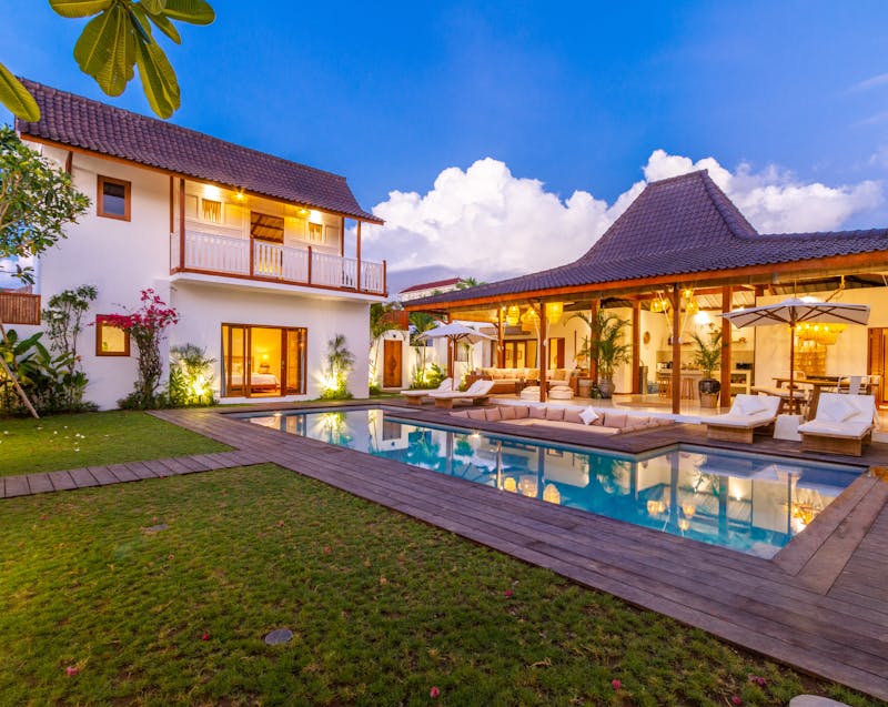 a well-lit home exterior and landscaping